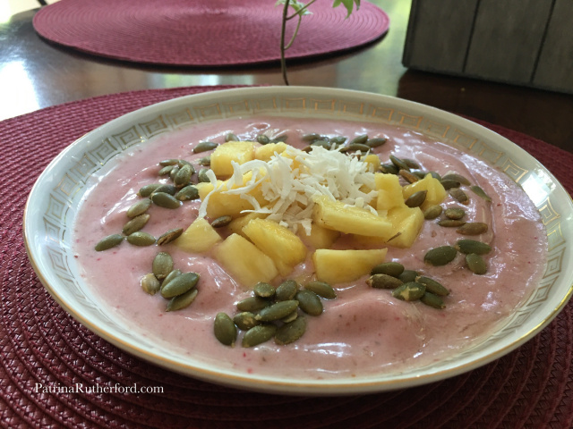 Banana Strawberry Smoothie Bowl in coconut milk. Topped with chunks of pineapple, coconut flakes and pumpkin seeds. SpacificsbyPatrinaRutherford